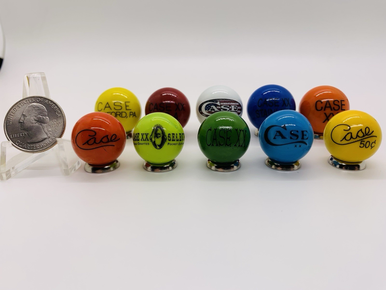 10 Case XX KNIFE/KNIVES Advertising Assorted Glass Shooter Marbles & Stands.