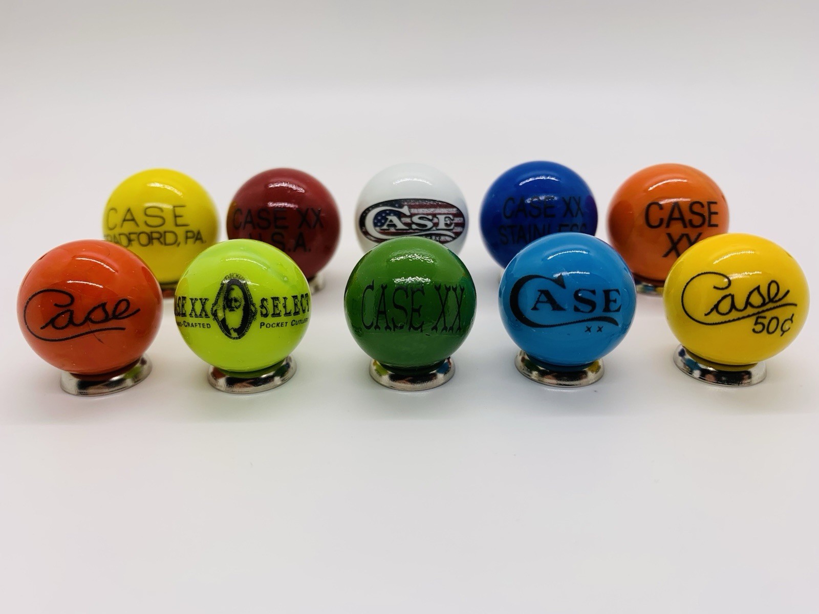 10 Case XX KNIFE/KNIVES Advertising Assorted Glass Shooter Marbles & Stands.