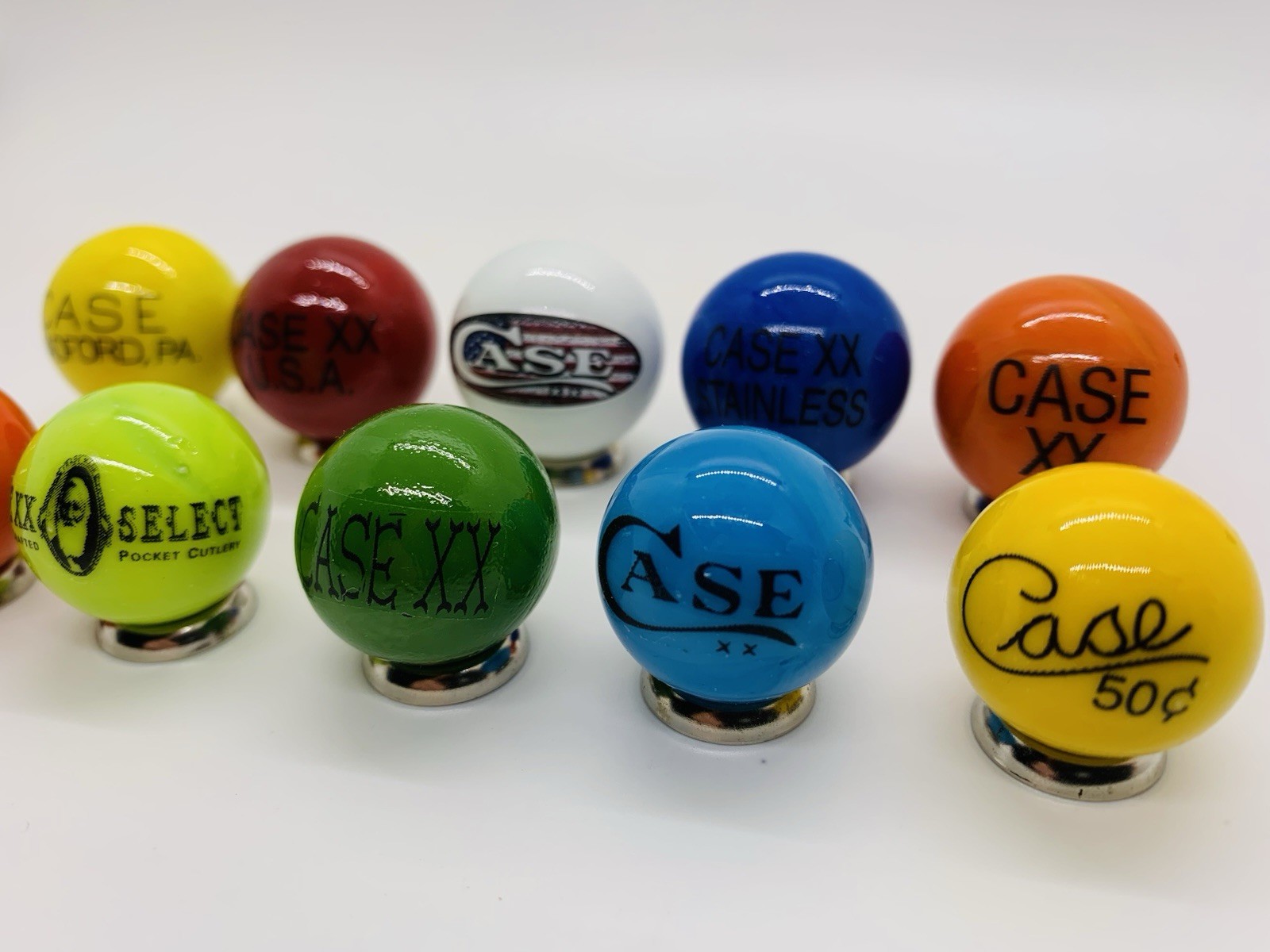 10 Case XX KNIFE/KNIVES Advertising Assorted Glass Shooter Marbles & Stands.