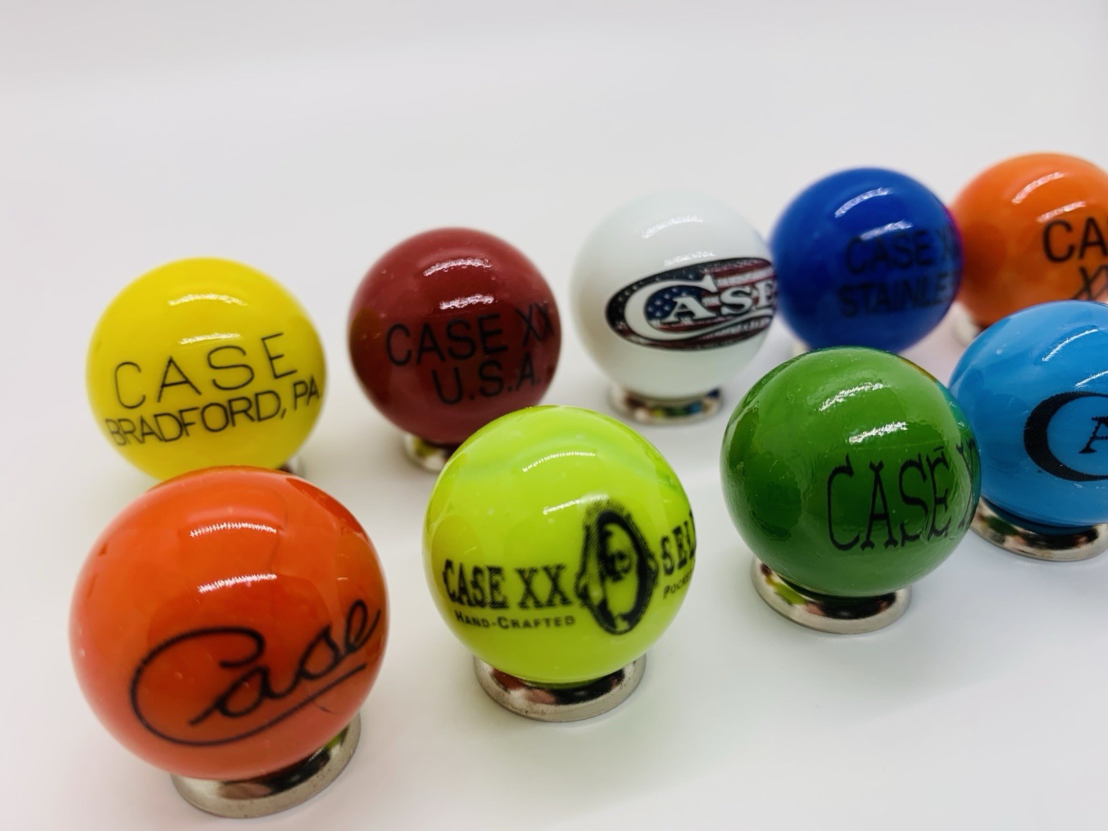 10 Case XX KNIFE/KNIVES Advertising Assorted Glass Shooter Marbles & Stands.